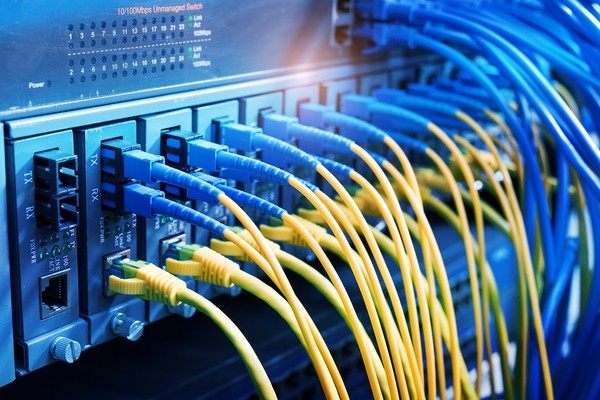 Network switch with blue and yellow cables connected