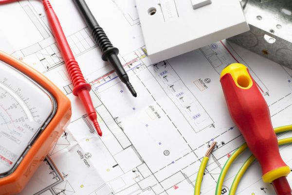 Electrical testing equipment on top of electrical diagrams