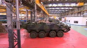 Armored vehicle inside a factory setting